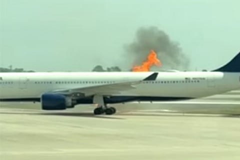 plane catches fire