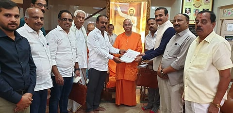 Handing over of cheque to SMK Endowment Fund Mandya