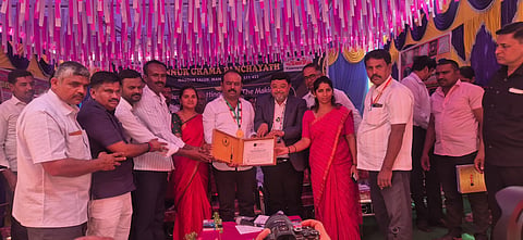 Receiving the award from the India Book of Records Mandya