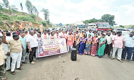 BJP workers protest by blocking the road