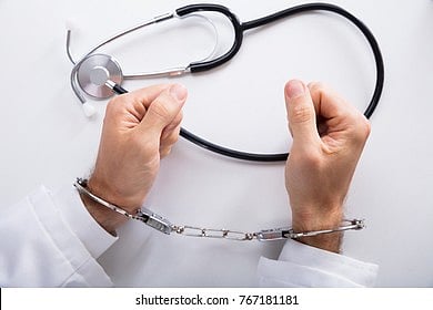 elevated-view-arrested-doctors-hand-260nw-767181181