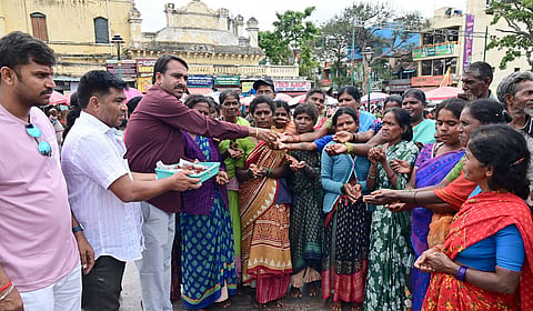 Distribution of clay lamps on the occasion of Deepavali in Mysore