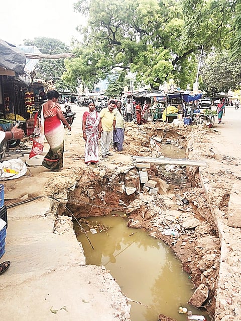Gram Panchayat's negligence in leaving the drain uncovered.