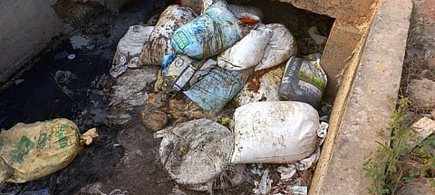 Take action against those who dump waste into the drains.
