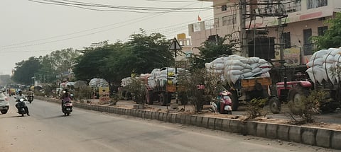 Tractors lined up at the millet purchasing center