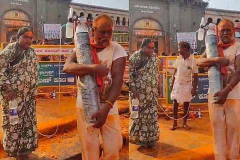 ಆಕ್ಸಿಜನ್ ಸಿಲಿಂಡರ್​ ಹಿಡಿದು ದೇವರ ದರ್ಶನ ಪಡೆದ ದಂಪತಿ