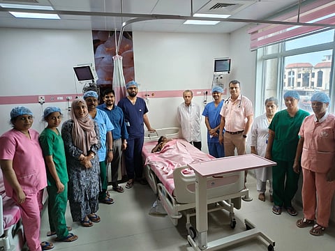 ಗರ್ಭಕೋಶದಲ್ಲಿದ್ದ ಗಡ್ಡೆ ತೆರವು ಬಳಿಕ ಚೇತರಿಸಿಕೊಂಡ ಮಹಿಳೆಯೊಂದಿಗೆ ತಾಯಿ ಮತ್ತು ಮಕ್ಕಳ ಸರ್ಕಾರಿ ಜಿಲ್ಲಾಸ್ಪತ್ರೆ ಉಡುಪಿಯ ವೈದ್ಯರ ತಂಡ. ಡಾ. ಎಚ್​. ಅಶೋಕ್​, ಡಾ.ಶಶಾಂಕ್​ ಕಿಣಿ, ಡಾ. ಜಾಸ್ಮಿನ್​, ಡಾ.ಕವಿತಾ, ಡಾ.ಅಮೃತಾಂಶ್​, ಡಾ. ಸೂರ್ಯನಾರಾಯಣ, ಡಾ.ರಾಜ್​ ಗೋಪಾಲ್​ ಭಂಡಾರಿ, ಶುಶ್ರೂಷಕಾಧಿಕಾರಿ ರಕ್ಷಿತಾ, ಒಟಿ ಸಹಾಯಕಿ ಸಂಗೀತಾ ಇದ್ದಾರೆ. 