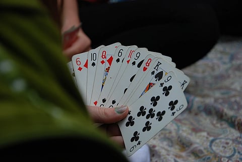 Three arrested for playing cards
