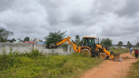Officials abet encroachment of government land.