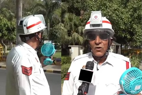 ಎಸಿ ಹೆಲ್ಮೆಟ್ ಹಾಗೂ ಕೈಯಲ್ಲಿ ಫ್ಯಾನ್ ಹಿಡಿದು ಕರ್ತವ್ಯ ನಿರ್ವಹಿಸುತ್ತಿರುವ ಟ್ರಾಫಿಕ್ ಪೊಲೀಸ್​