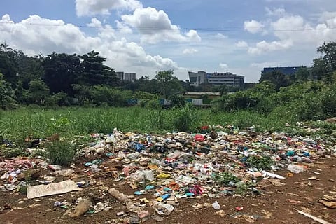 Woman found in garbage pile rescued