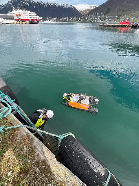 Runar Warberg and the USV Otter in Tromsø harbour.