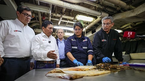 Peru's Minister of Production, César Manuel Quispe Luján, talking with experts aboard the BIC Humboldt cruise.