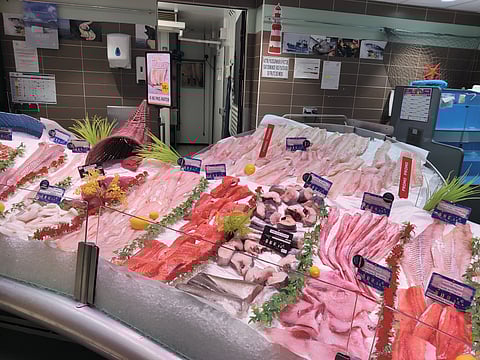 Fish counter in a supermarket in Angers, France, displaying Norwegian seafood products.