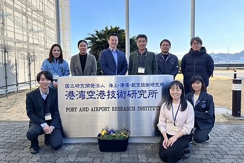 Brian Tsuyoshi Takeda is the third from the left in the back row. Dr. Tomohiro Kuwae is to his right, and Dr. Kenta Watanabe is to his right. 