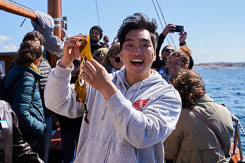 A conference participant pictured on this year's site visit to Nordic SeaFarm's seaweed cultivation site in the Grebbestad archipelago.