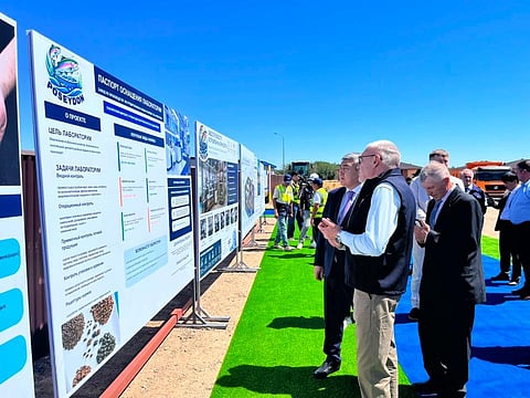 Officials pictured at the construction site of Kazakhstan's new aquafeed plant.