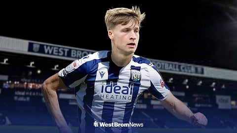 Jimmy-Jay Morgan in a West Bromwich Albion kit in front of The Hawthorns.