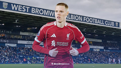 Carter Pinnington in a Liverpool kit, with The Hawthorns behind him