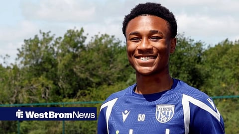 Jaiden Francis-Caesar posing at West Brom's training ground after signing his first professional contract