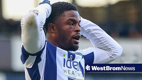 Josh Maja with his hands on his head while playing for West Brom