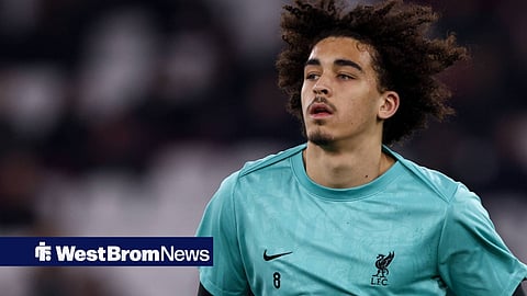 Jayden Danns warming up for Liverpool