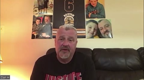 Dan Hartman speaks with pictures of his son in the background