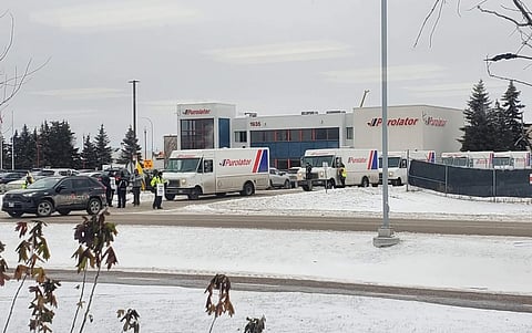 Striking postal working blocking Purolator trucks