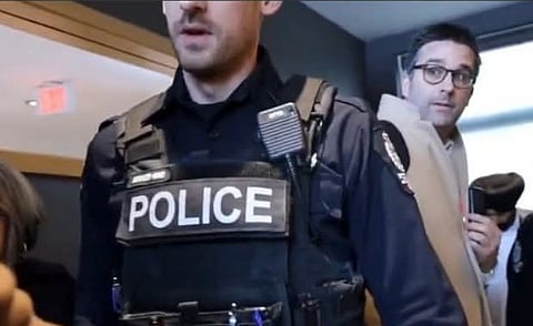 Western Standard reporter James Snell being removed by police from Mark Carney's Liberal leadership event in Edmonton.