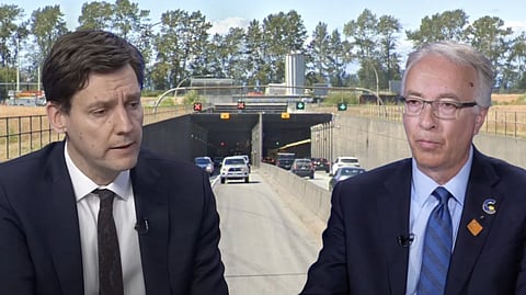 David Eby and John Rustad in front of the Massey Tunnel