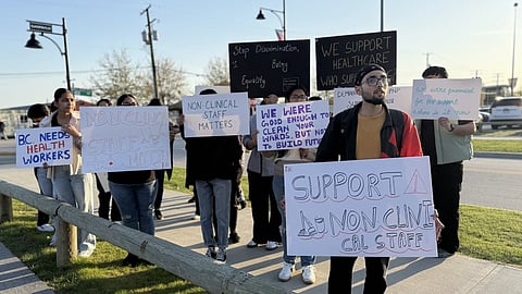 Non-clinical healthcare staff outside Mark Carney's rally in Surrey, BC