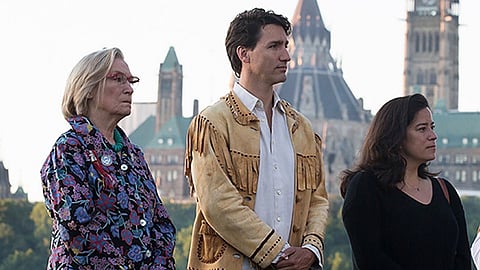 Indigenous Affairs Minister Carolyn Bennett, Prime Minister Justin Trudeau, Justice Minister Jody Wilson-Raybould and guests take part in ceremony for National Aboriginal Day on Parliament Hill, June 21, 2016. 