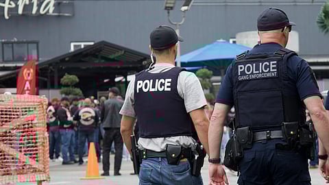Police and Hells Angels members outside Aria Banquet & Convention Centre in Surrey, BC