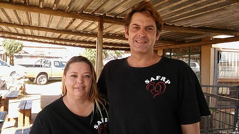 Leigh du Preez (left,) founder of a family relief project to serve destitute whites in South Africa