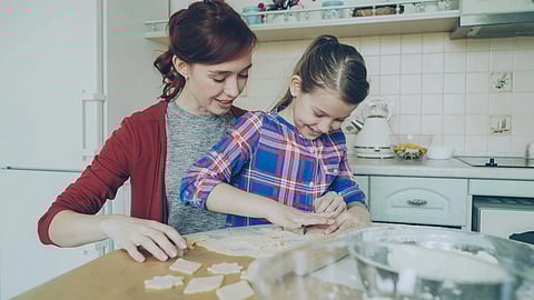 Mother with child baking