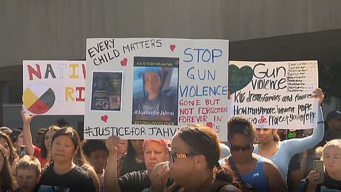 Protestors gathered at Toronto's City Hall after an eight-year-old boy was tragically killed by a stray bullet in North York, Toronto. 