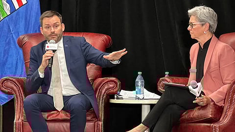 Parti Québécois leader Paul St-Pierre Plamondon (left) in Calgary on Sept 11.