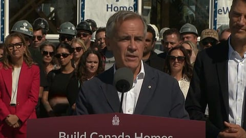 Prime Minister Mark Carney in front of the "home" that was built in Nepean Ontario