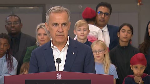 Prime Minister Mark Carney speaking to reporters in Ottawa