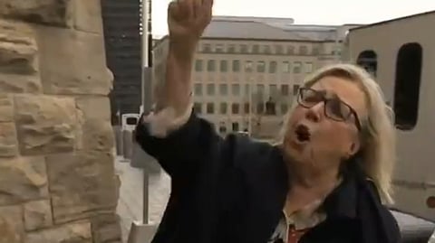 May cheering for Ford outside of Parliament