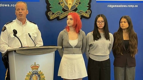  Insp. Martin Guay presents Officer in Charge Certificate of Appreciation awards to Indiana Gerard, Chloe He, and Sophia Jasemianaasl