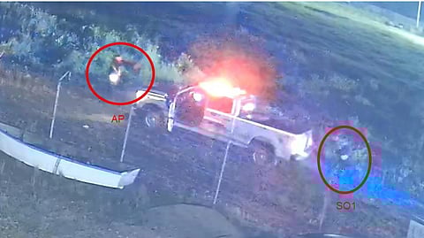 Youth, left, approaches RCMP officer holding backpack