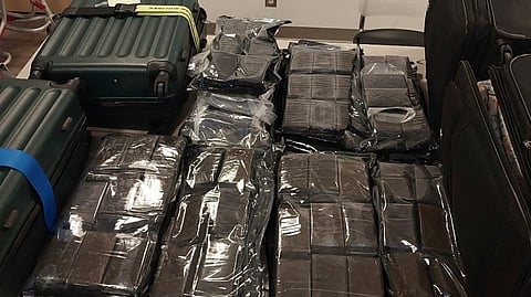 Calgary police charge two men after $1.2-million hashish haul found in airport luggage

