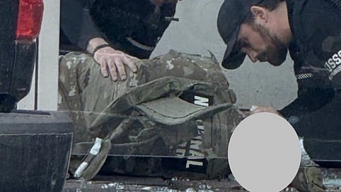 One of the victims of the shooting on the ground following the incident. 