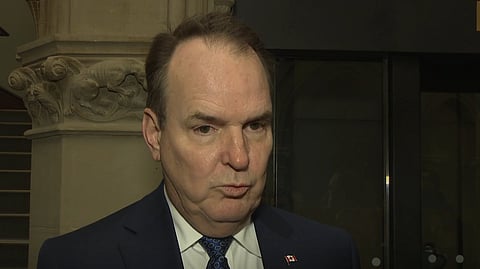 Government House Leader Steven MacKinnon on his way to a cabinet meeting speaking to reporters