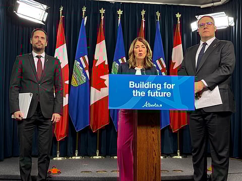 Danielle Smith, Jason Nixon, and Matt Jones stand as they announce Alberta's Assisted Living Framework. 