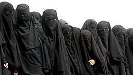 A line of women in burqas