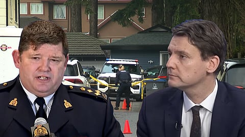 BC RCMP Assistant Commissioner John Brewer and Premier David Eby
