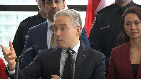 Champagne speaking at the press conference 