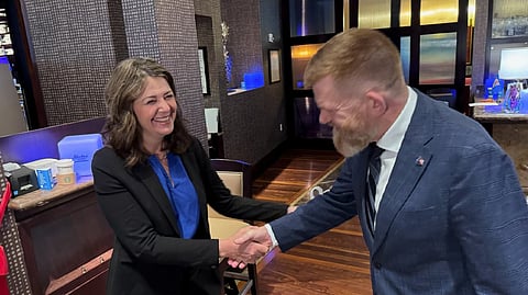 Danielle Smith greeted Brian Jean in Houston last year